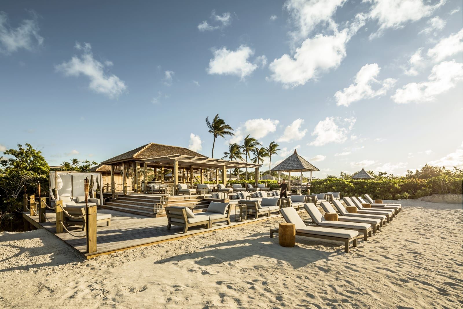Beach deck with loungers and shade pavilions