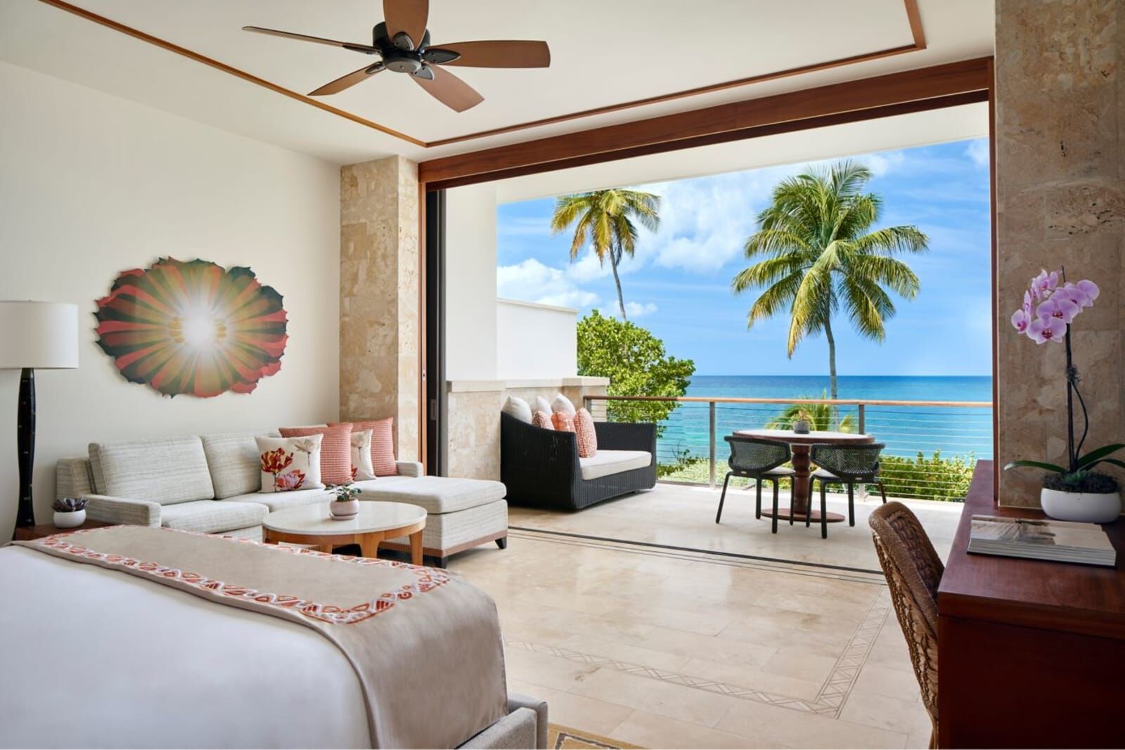 Bedroom with a sitting area open to an ocean terrace