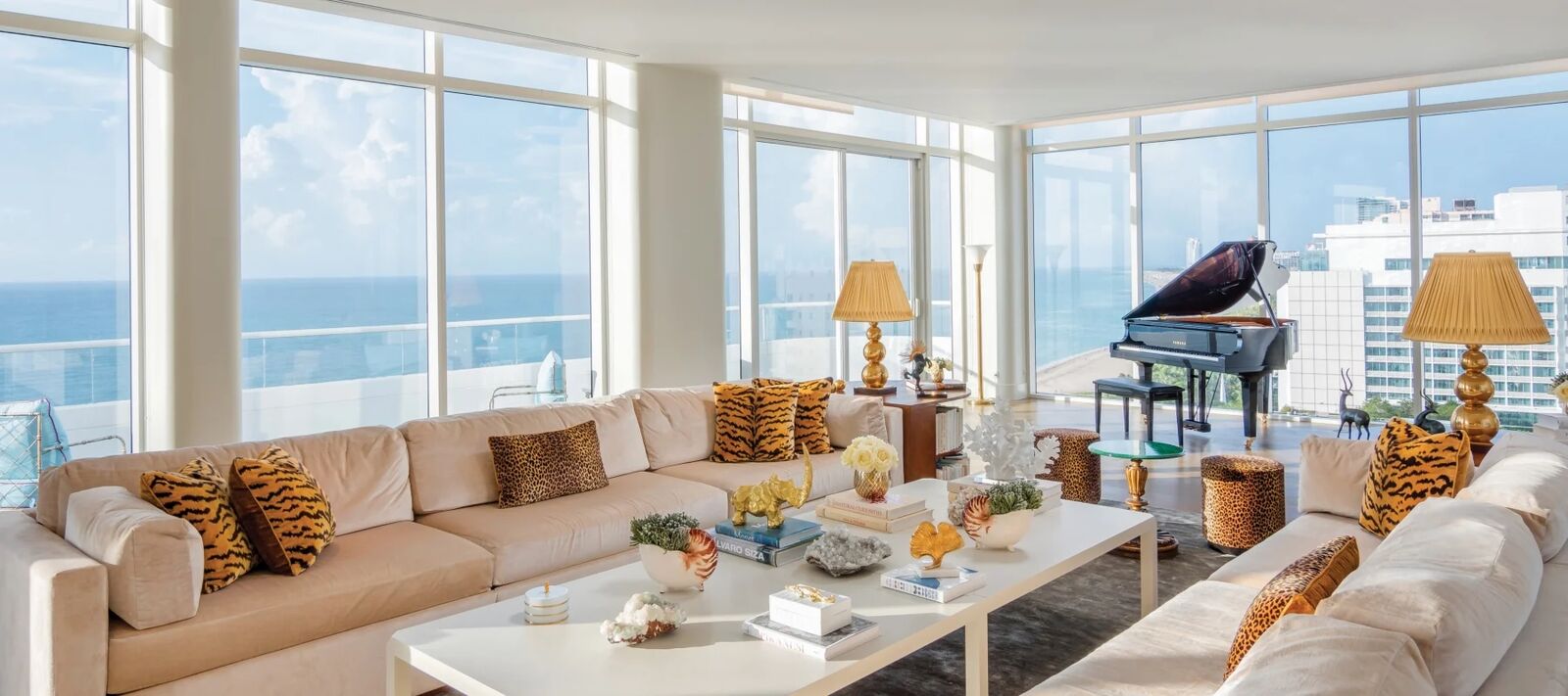 Faena Penthouse Suite living room with grand piano and ocean views