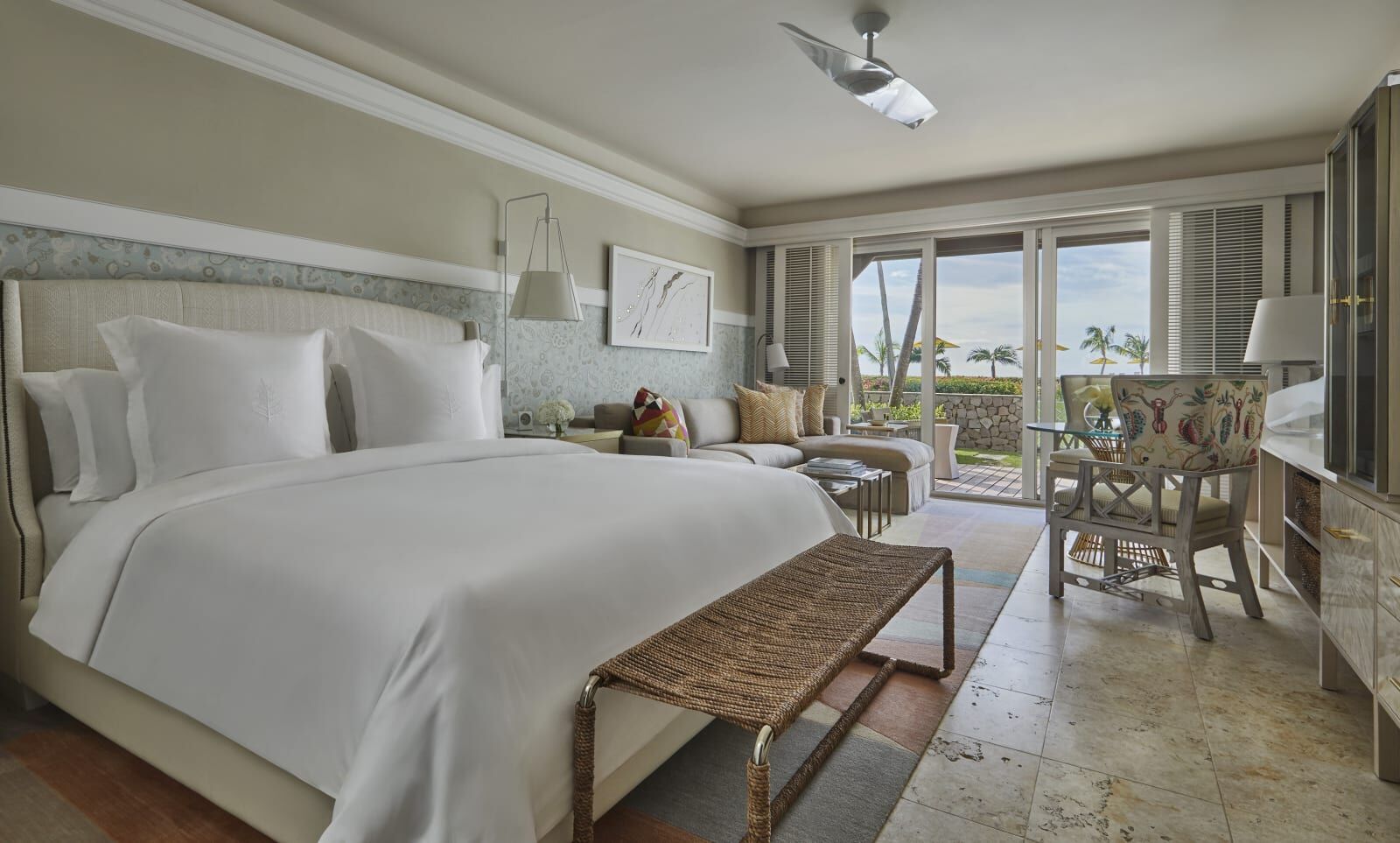 Bedroom with a sitting area and garden view