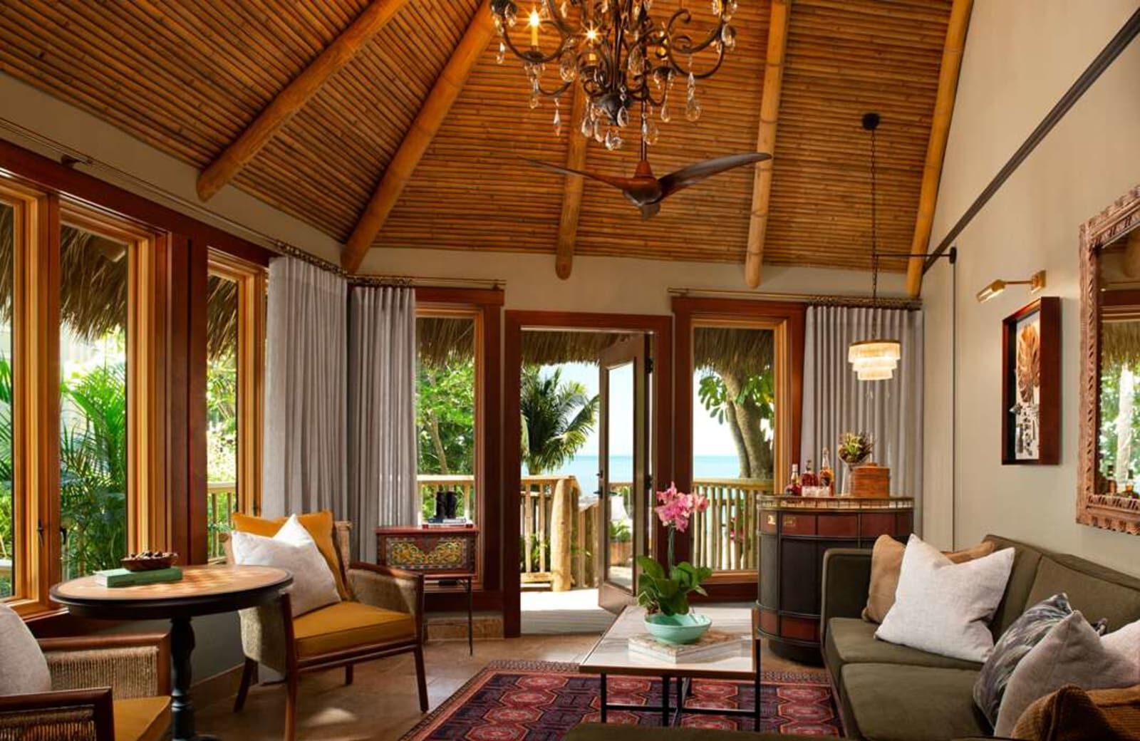 Suite living room under a high wooden ceiling