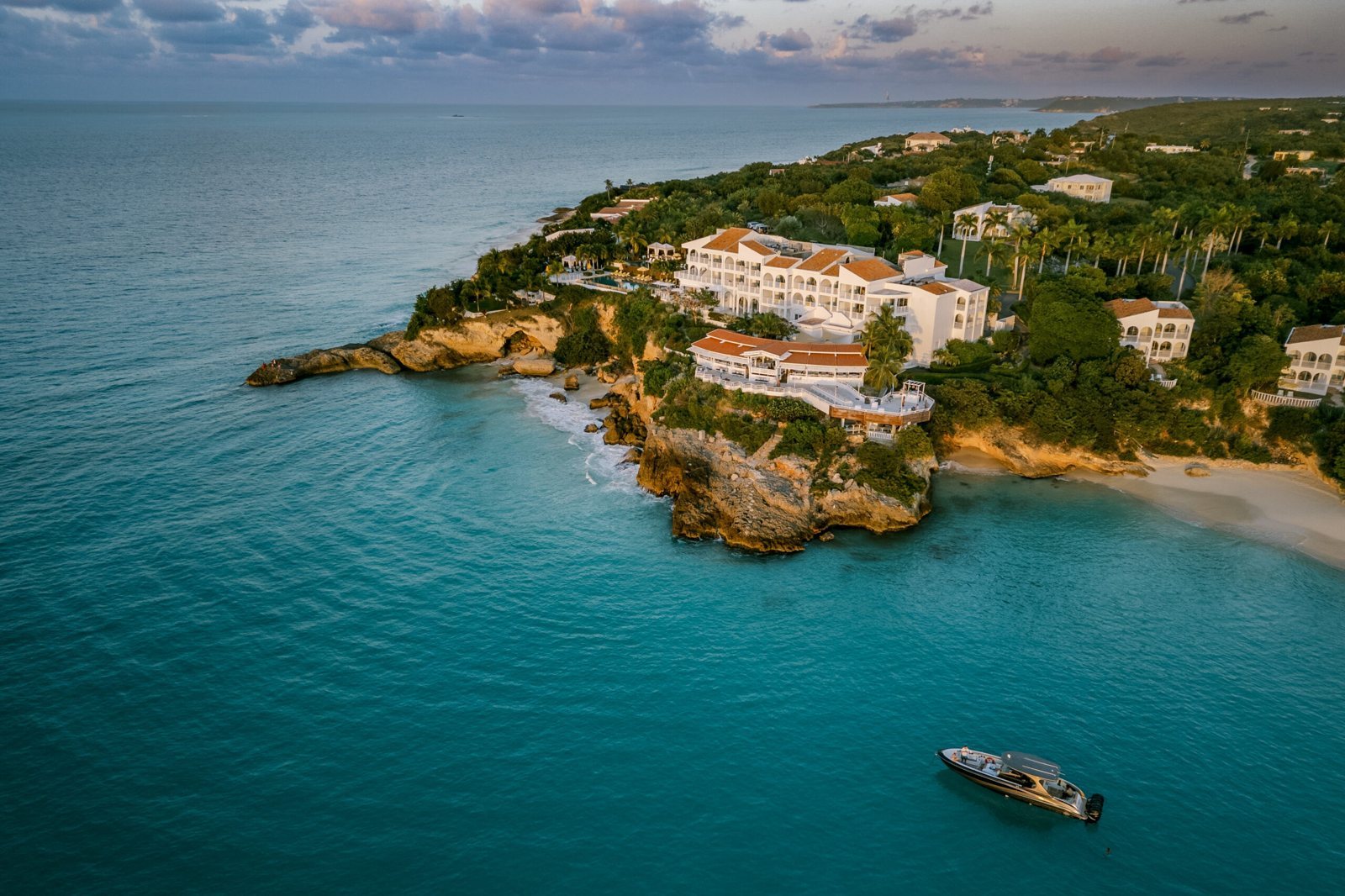 Malliouhana from the air, with a boat offshore