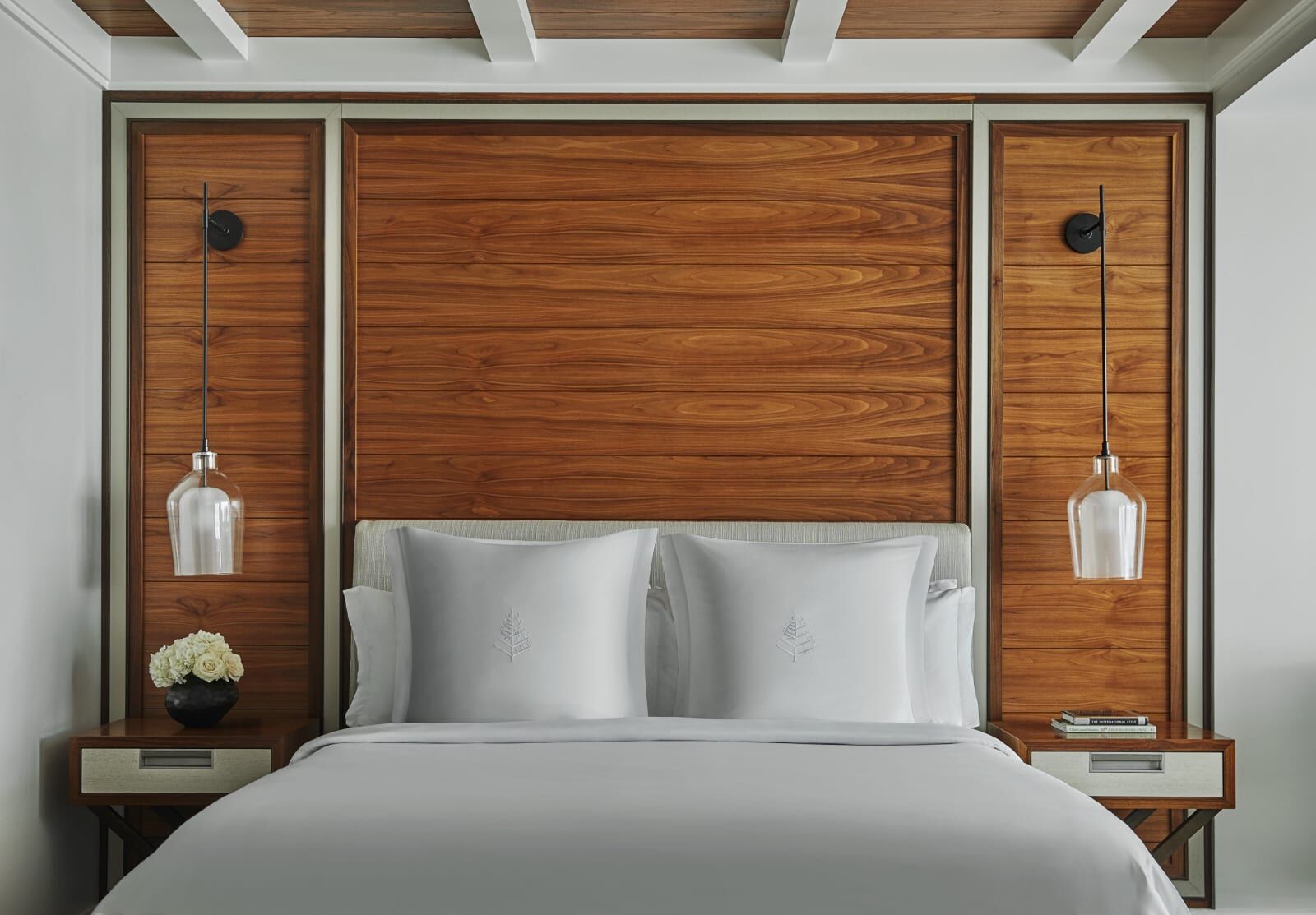Guest room bedroom with a wood-panelled headboard