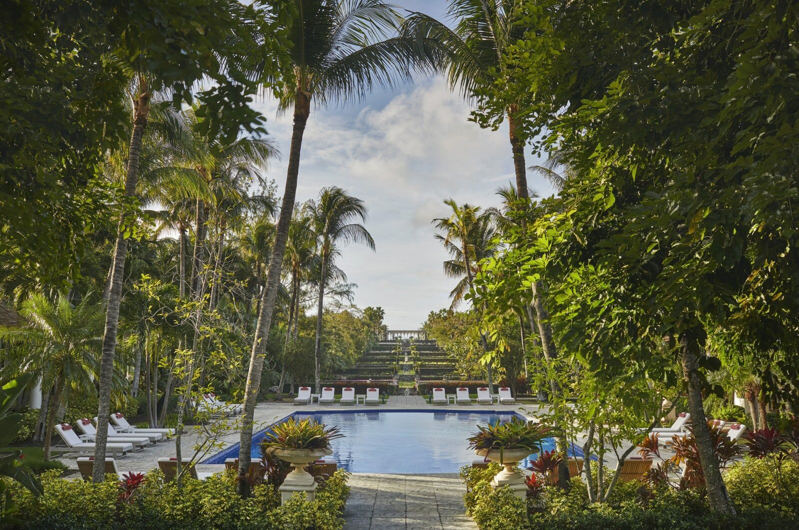 Terraced gardens leading down to a pool