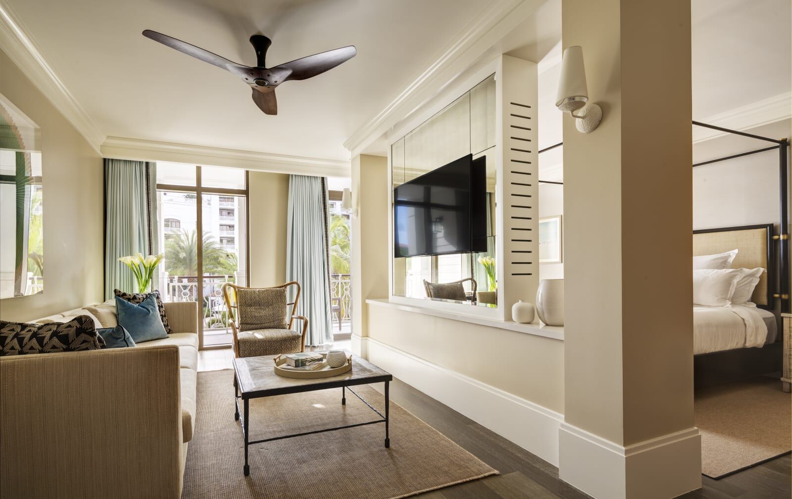Suite sitting area with the bed beyond