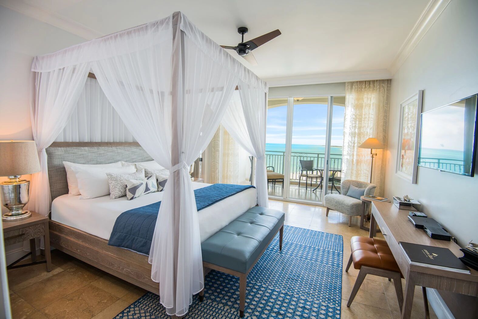 Canopy bed facing balcony doors