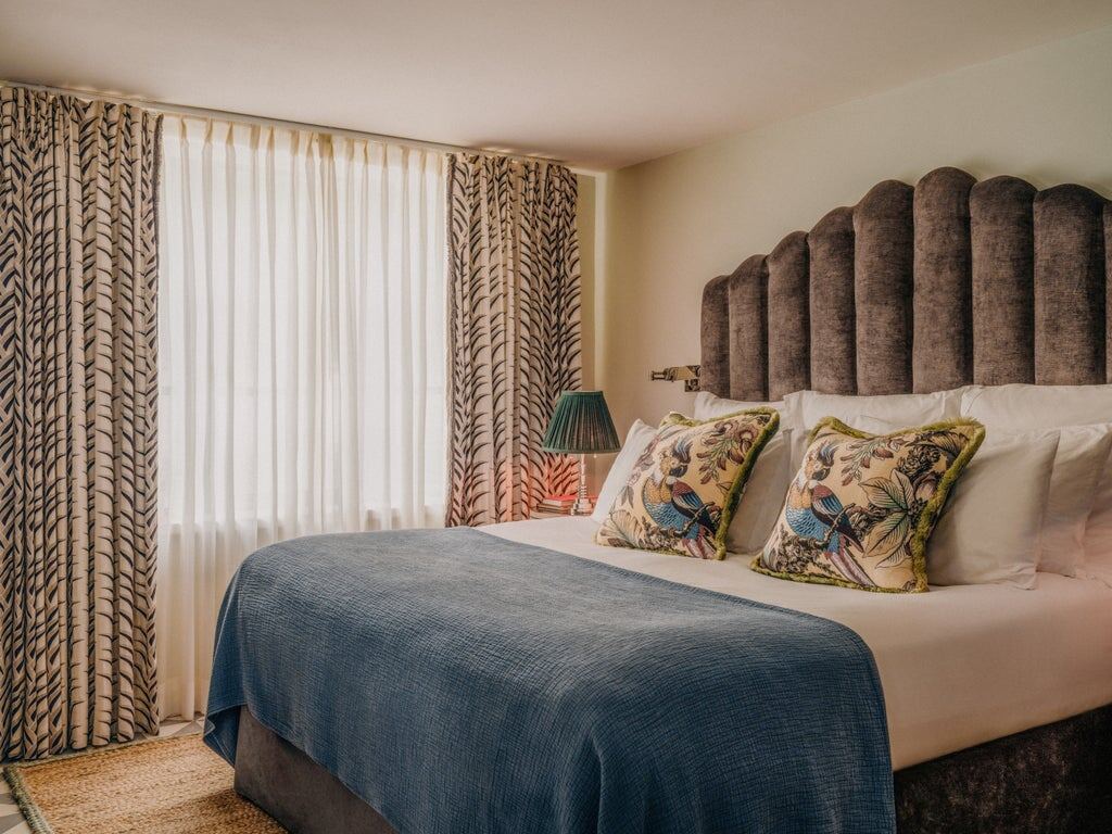 Cosy bedroom with patterned headboard