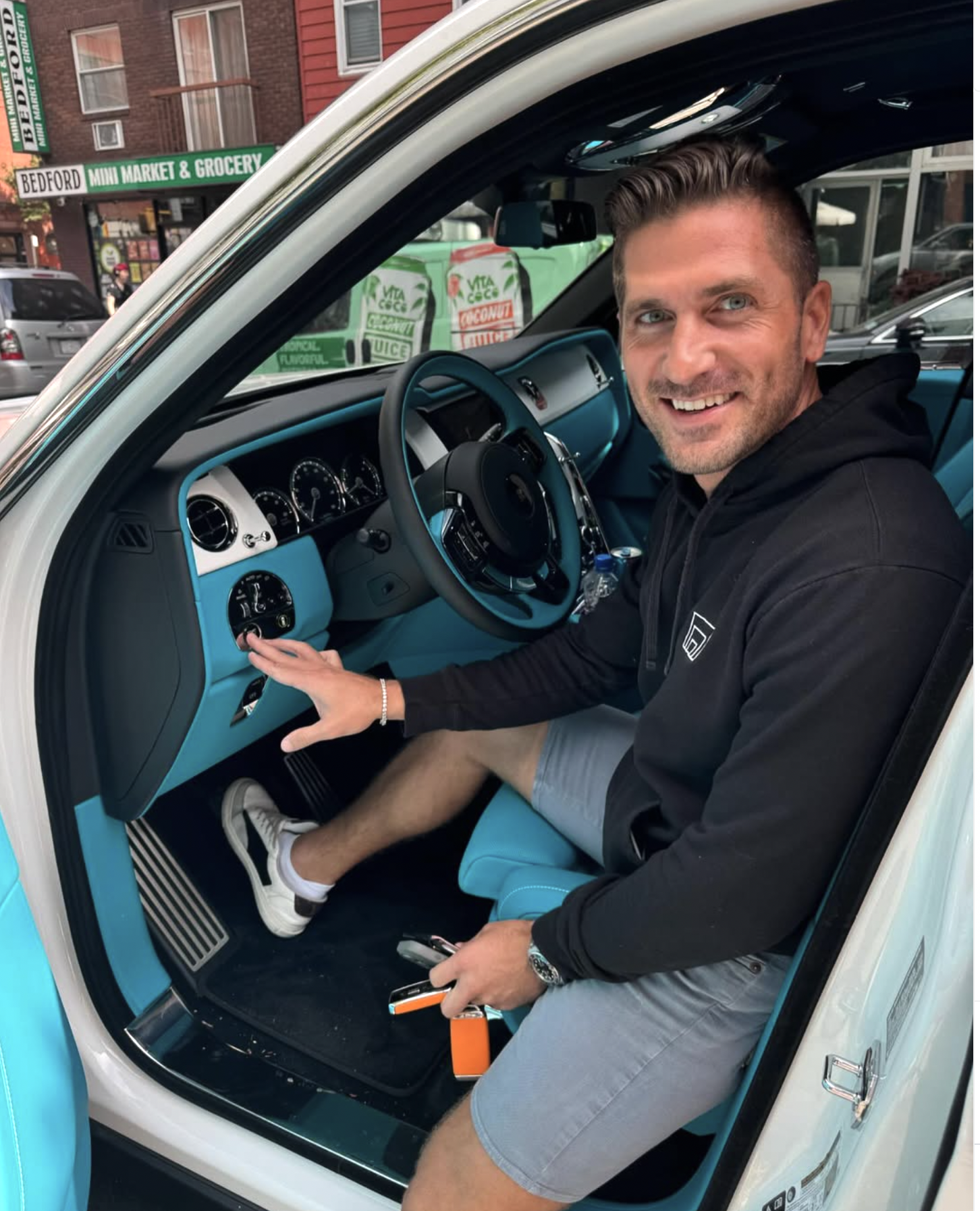 Robert Dunn seated in a Rolls-Royce